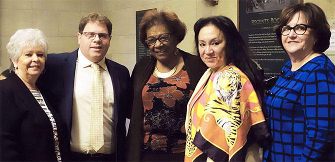 Yonkers teacher Mitchell Polay, second from left, celebrates his award with, from left, his mother, Anita Carangelo; Regent Judith Johnson; Chancellor Betty Rosa, and Commissioner MaryEllen Elia.
