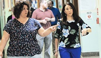 NYSUT Executive Vice President Jolene DiBrango, right, walks with Nicole Capello, vice president of Syracuse TA, during a recent visit with teachers and students at the Salem Hyde Elementary School. Photo by Steve Jacobs.