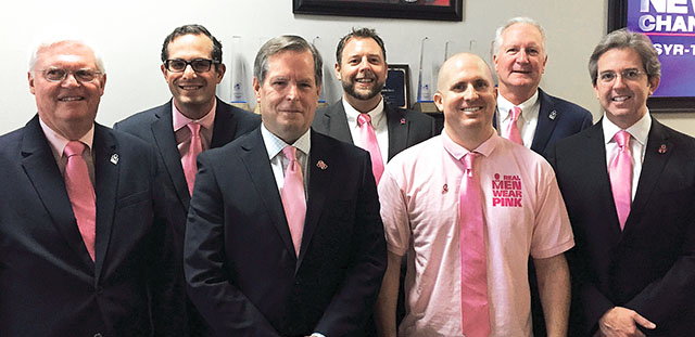 From left: Taking part in the Real Men wear Pink initiative are, from left, Jeff Bastable, Laurence Segal, Sheriff Gene Conway, Brian Bartlett, Rick Roberts, Dan Hartnett and Chris Colabello.