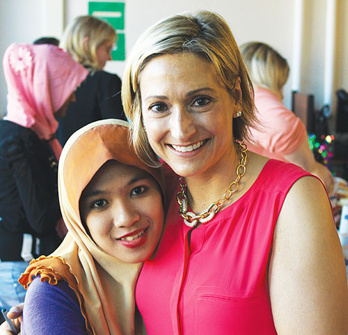 Albany PSTA’s Betsey Domenico, an English as a New Language teacher and new National Board Certified Teacher, with one of her students. Photo provided by the City School District of Albany.