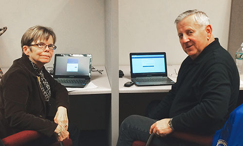 Mary Jo Rankin, RC 11, and Andy Kavulich, RC 11 president, work the phone bank at NYSUT’s Vestal Regional Office.