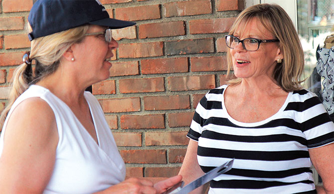 Sally Lord of Ulster County BOCES chats about the value of being a member of a union with Wendy Ashline of the North Colonie Teachers Association. Photo by Becky Miller.