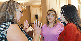 SRPs Annie McClintock and Cheryl Rockhill talk with NYSUT Executive Vice President Jolene DiBrango during ELT training this summer. Photo by El-Wise Noisette.