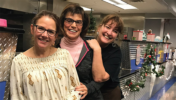 An army of volunteers keep the South End Children’s Café running, including, from left, Bethlehem teacher Cindy MacCallum, volunteer Sandra Munella Olson and cafe founder, Tracie Killar.