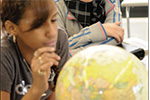 student with globe