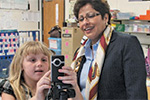 student with flip video camera