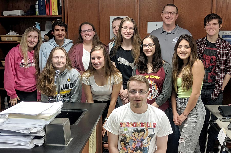 Batavia leader with students