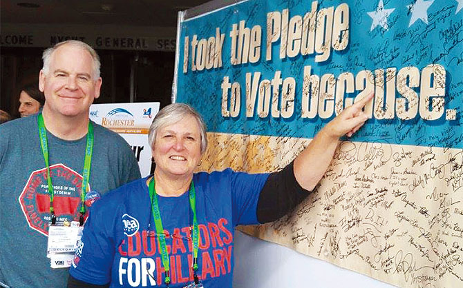 Deb Peterson, RC 43 president, and David Dougherty, Haldane Faculty Association, sign NYSUT’s pledge to vote.