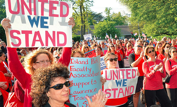 Hundreds rally in Lawrence, Nassau County, to support Lawrence TA members who have been working without a contract for the last six years. The local represents about 300 teachers, librarians, speech therapists and social workers.