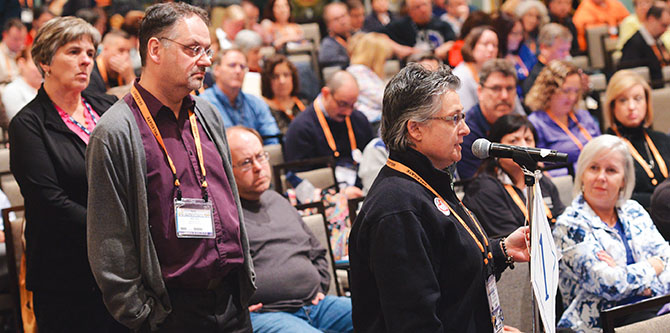 Local leaders line up to ask State Education Commissioner MaryEllen Elia questions. Utica TA President Cherie Grant, at microphone, voices frustration over using standardized tests to show student growth for teacher evaluations. “I have not grown anything but angrier and sad,” she says.
