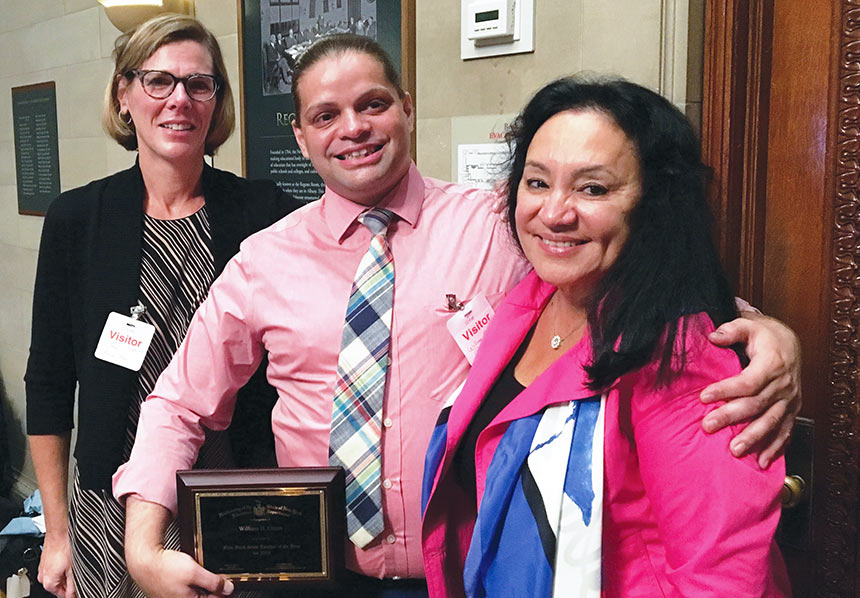 2019 Teacher of the Year finalist William Green, a member of the United Federation of Teachers, celebrates the recognition with his former teacher and mentor, Jane Kehoe-Higgins, left, a member of the Professional Staff Congress at CUNY, and Regents Chancellor Betty Rosa. Photo provided.